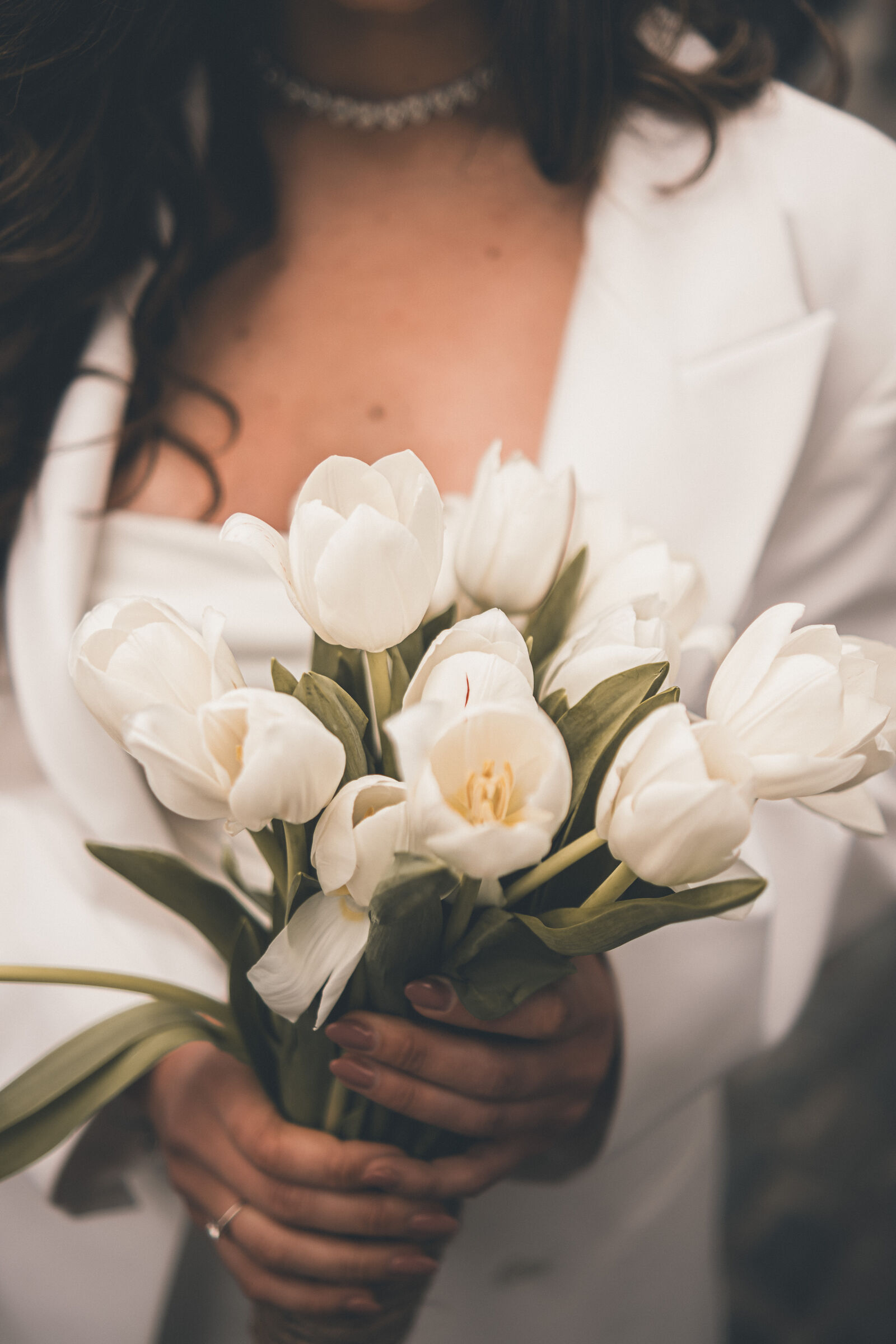 Wedding day detail — rings and hands