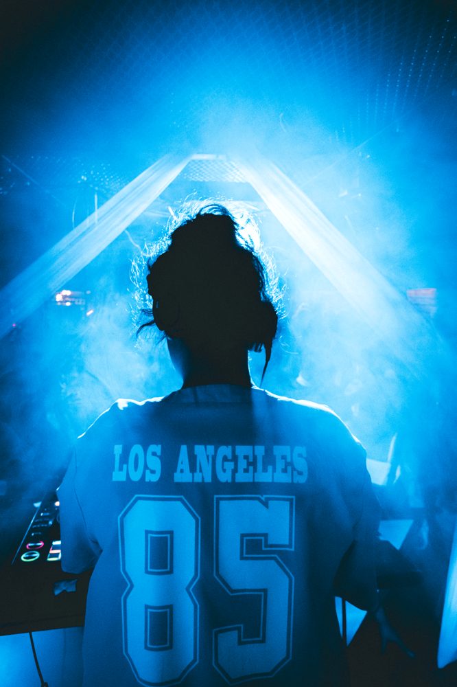 G!O live — silhouette in blue smoke